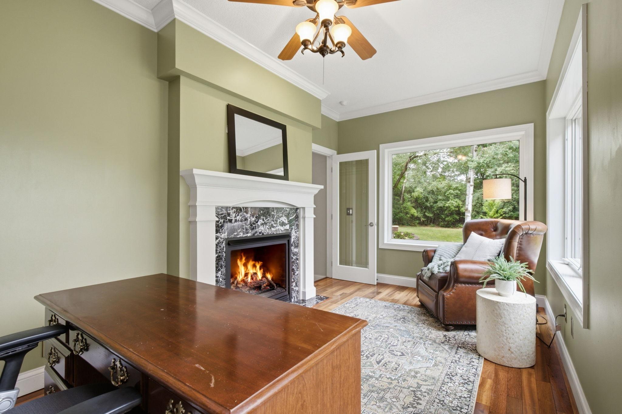 Perfect home office with peaceful views and a warm, inviting atmosphere. Or sunroom