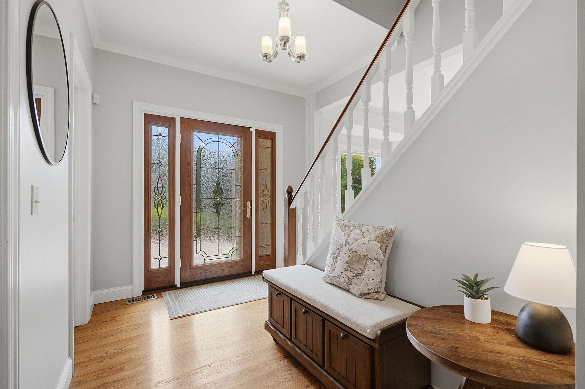 Welcoming foyer with beautiful hardwood floors that flow throughout the main level.