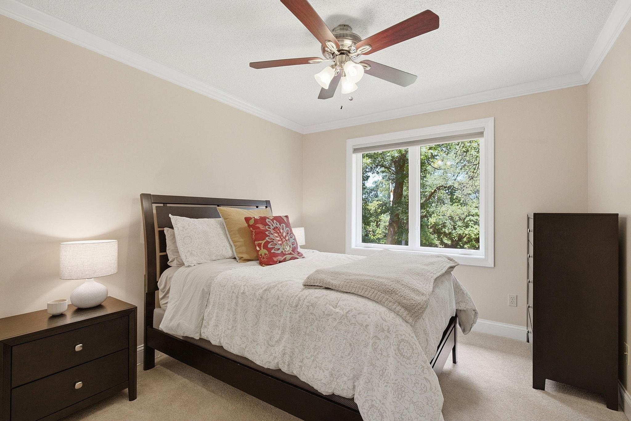 One of four spacious bedrooms conveniently located on the upper level.