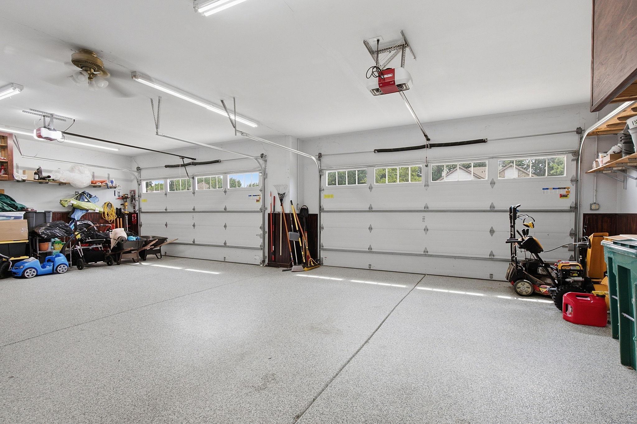 Oversized heated, insulated 4-car garage with epoxy floors.