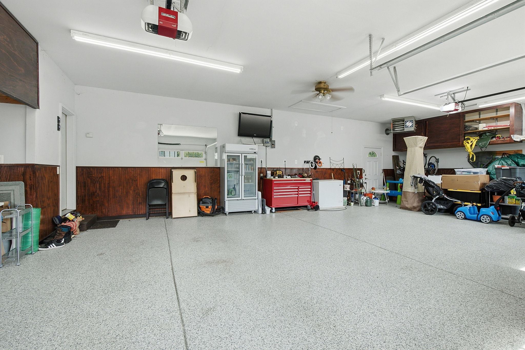 Oversized heated and insulated 4-car garage with durable epoxy floors.