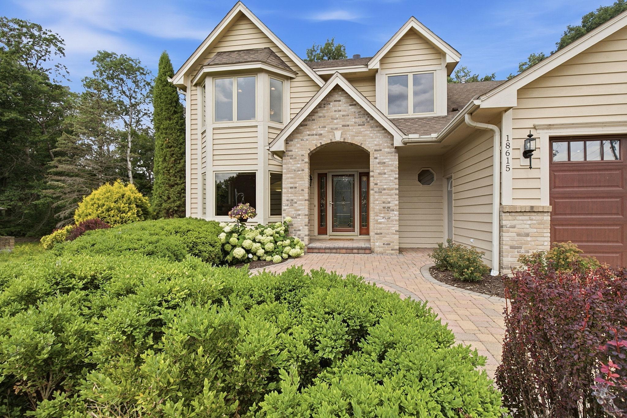 Exceptional two-story on a beautifully landscaped .45-acre corner lot.