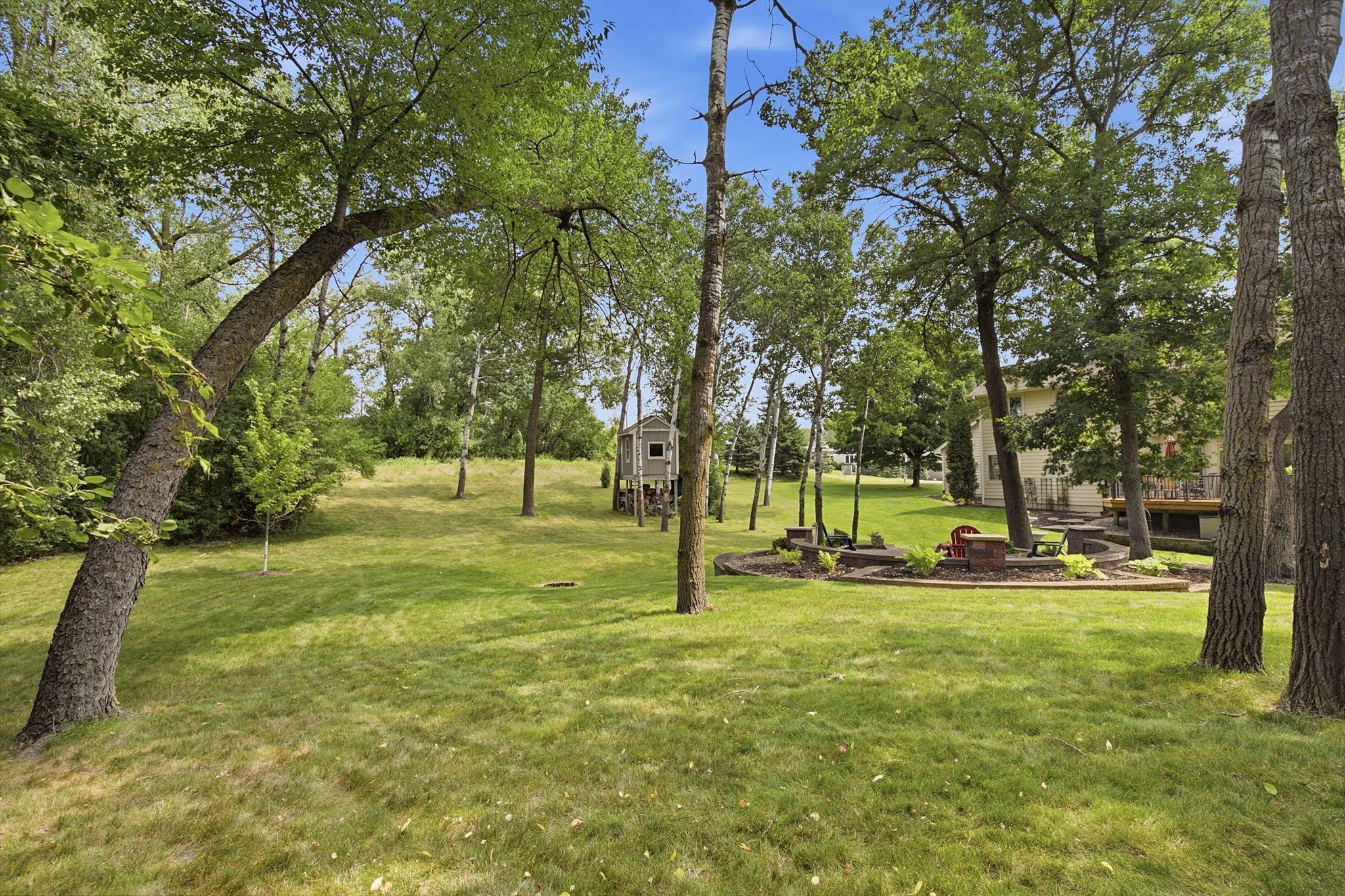 Mature landscaping creates a beautiful backdrop with exceptional privacy and year-round enjoyment.