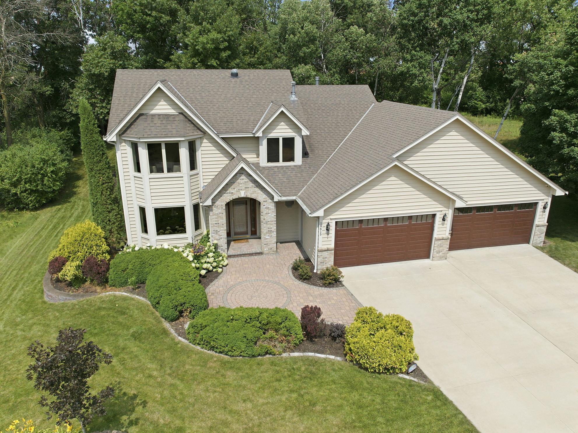Beautifully maintained home on a premium corner lot with outstanding curb appeal and an oversized heated 4-car garage.