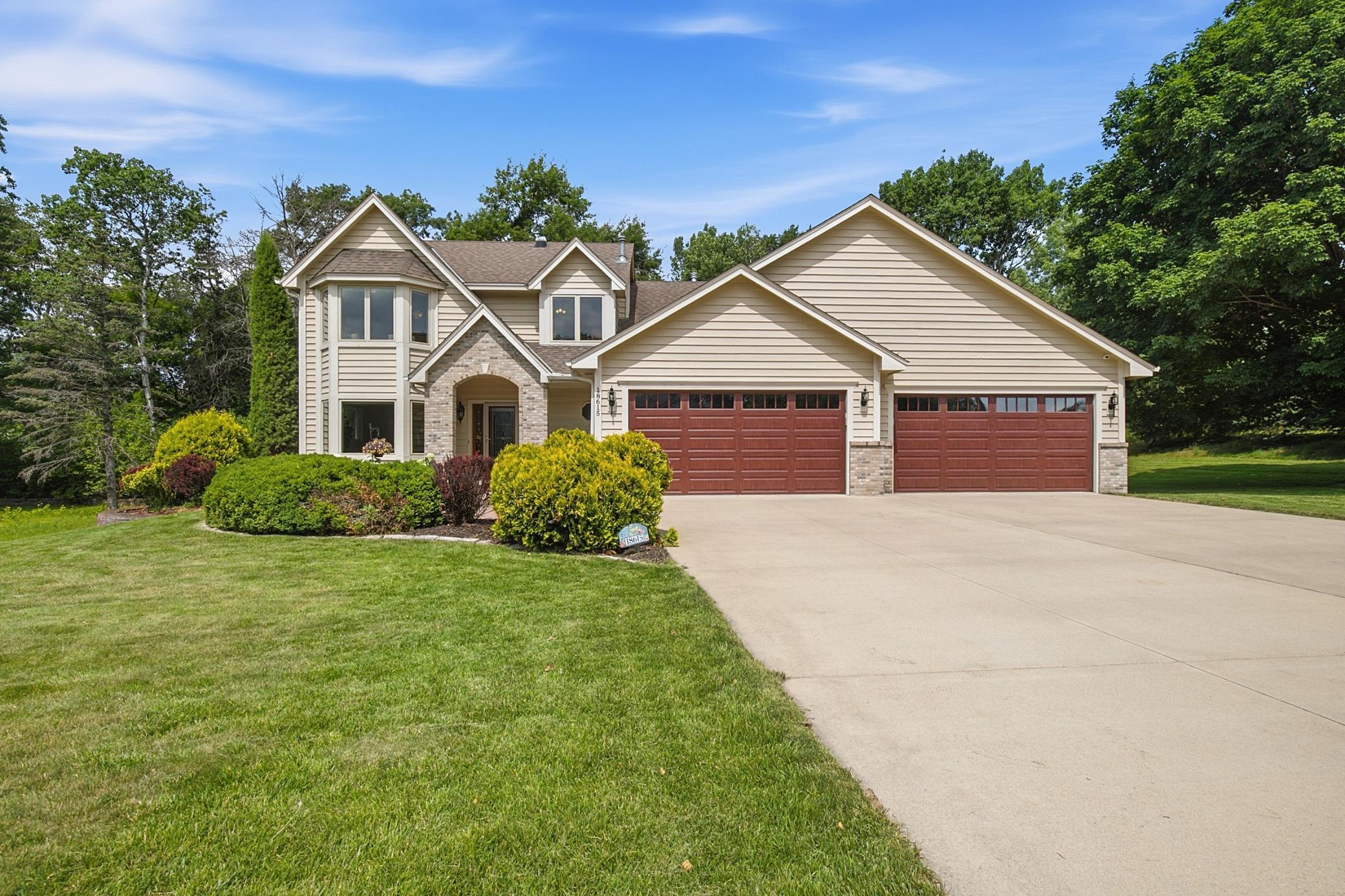 Exceptional curb appeal welcomes you home to this meticulously maintained two-story on a premium corner lot.
