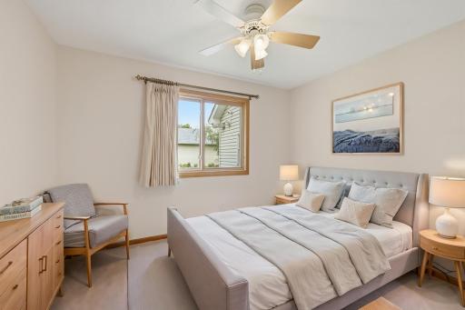 Virtually staged main floor bedroom 2>