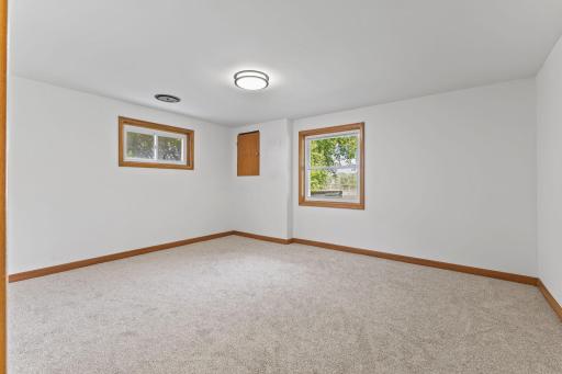Lower level bedroom with new carpet, ceiling, professional paint and a view of the lake!
