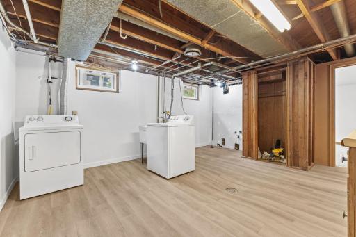 Lower level laundry with new LVP flooring throughout.