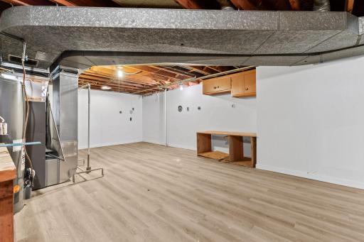 New LVP flooring continues in the area that provides space to finish off for added living space.