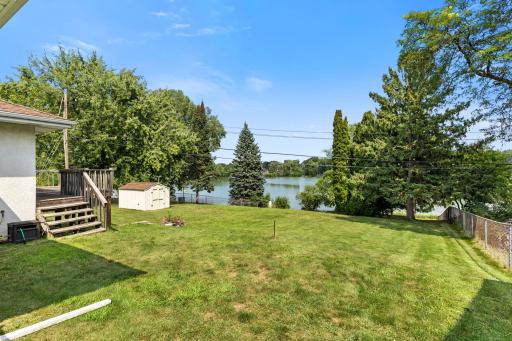 Your family will appreciate the expansive fenced in backyard (with double wide gate) and storage shed for games & lake items.
