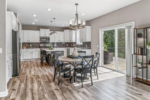 Informal dining area with walk out to the deck and backyard.