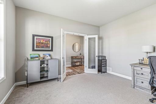 Another view of the main floor office showing French door entry.