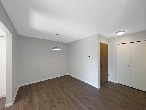 Unit features a coat closet next to the door to the hallway.