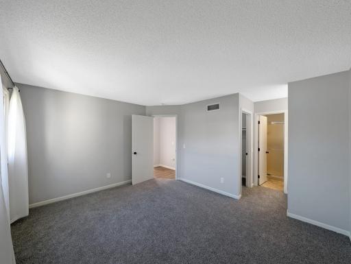 Primary bedroom with ensuite bath and walk in closet
