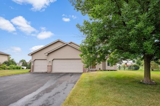 Welcome home to 6194 Karmen Ave NE! Charming split-entry featuring clean curb appeal and an attached 3 car garage.