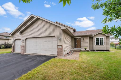 Welcome home to 6194 Karmen Ave NE! Charming split-entry featuring clean curb appeal and an attached 3 car garage.