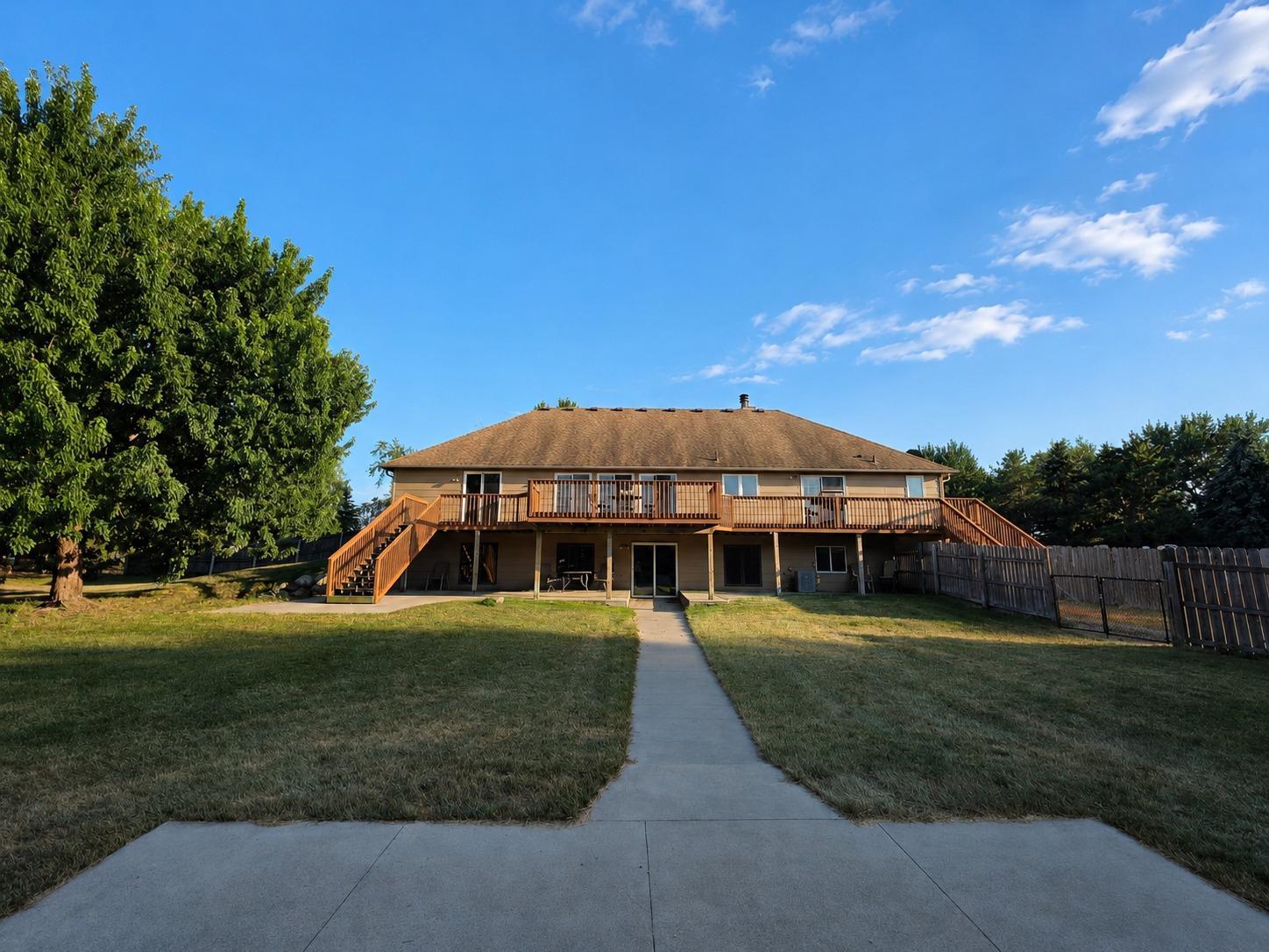 Back of Home with Walk Out/Deck & Patio Fenced in Yard