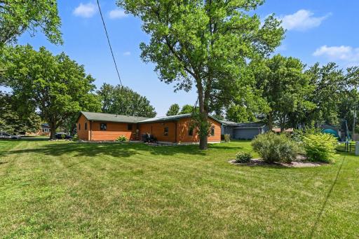 Beautifully landscaped yard plus it has been tiled & eaves on north side of house conveniently run into the storm sewer.