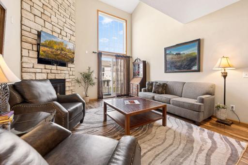 Comfortable living area with great natural light and an open feel. Sliding door leads to a private outdoor deck.