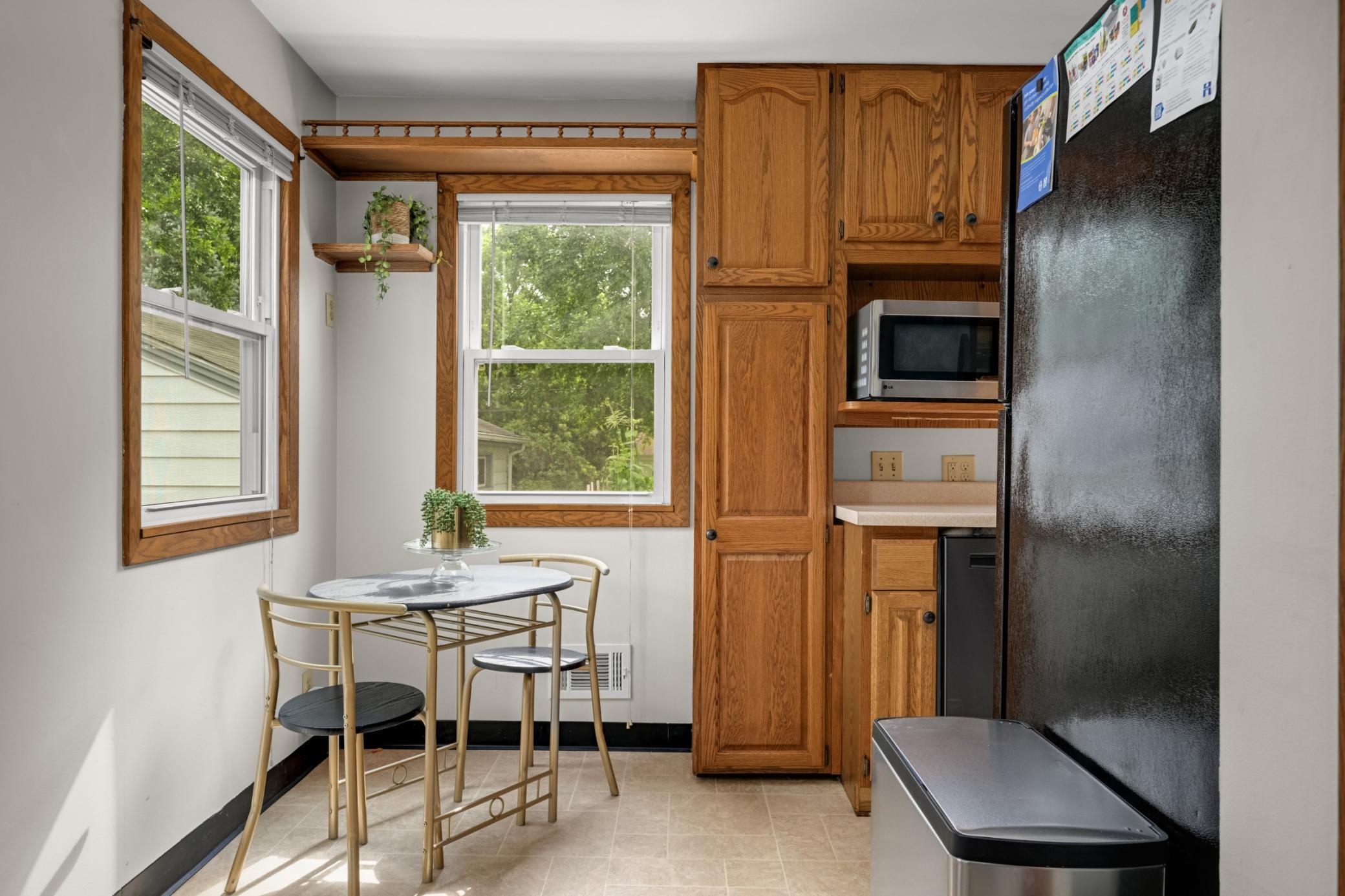 The kitchen has a sweet eat in area.