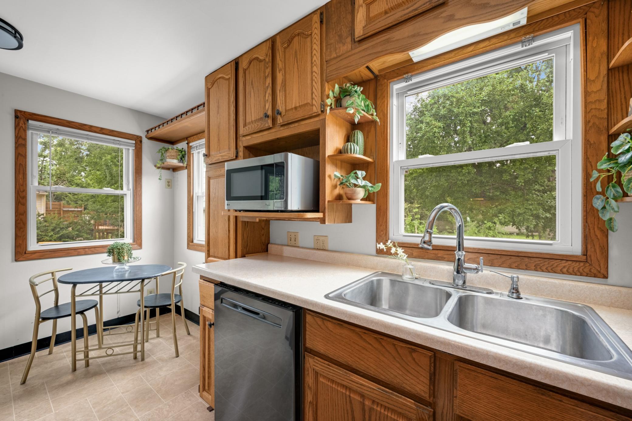 The kitchen window boasts a terrific view of the backyard.