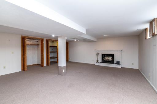 Lower Level Family Room with Wood Burning Fireplace