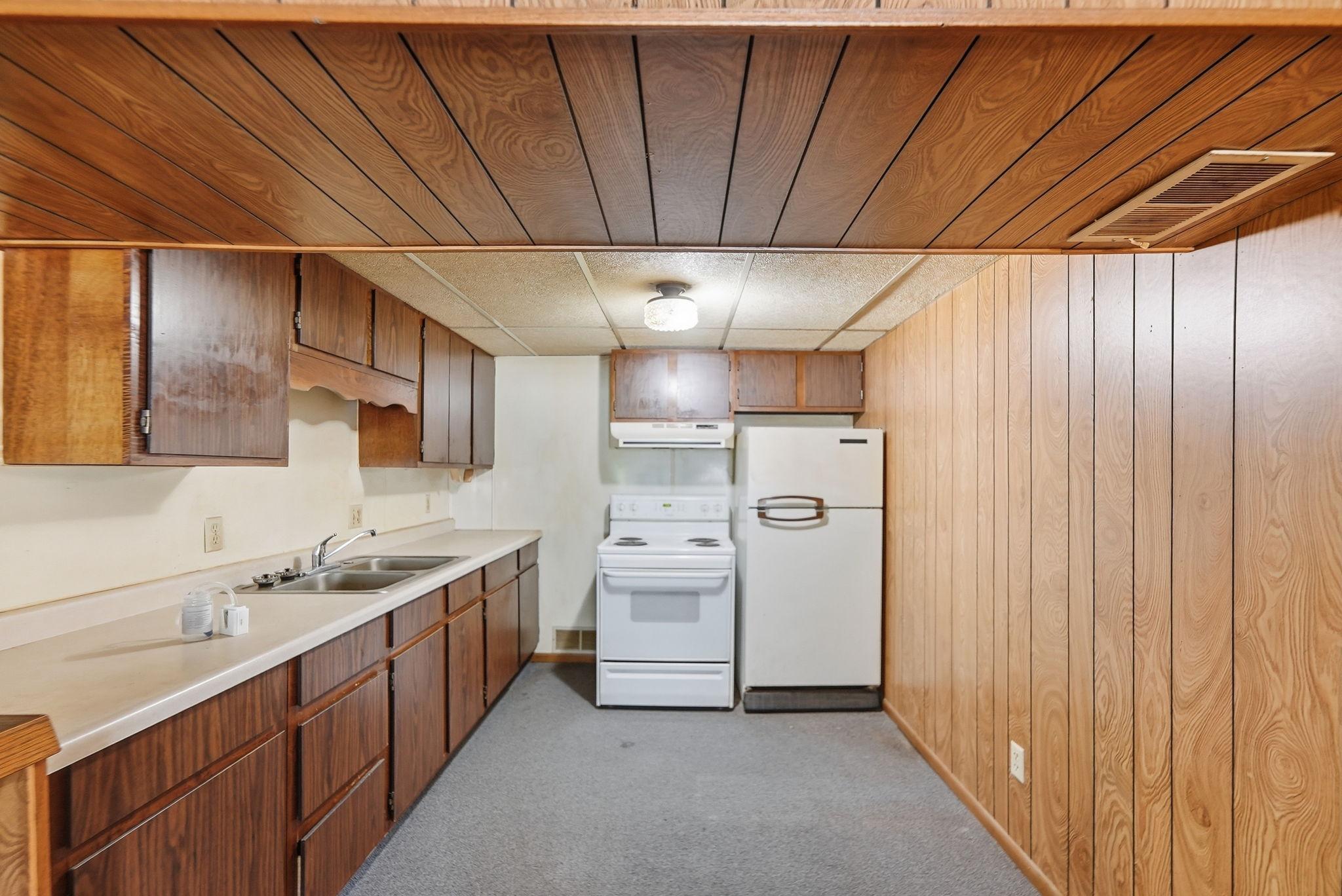 A convenient kitchenette adds flexibility for everyday living and entertaining.