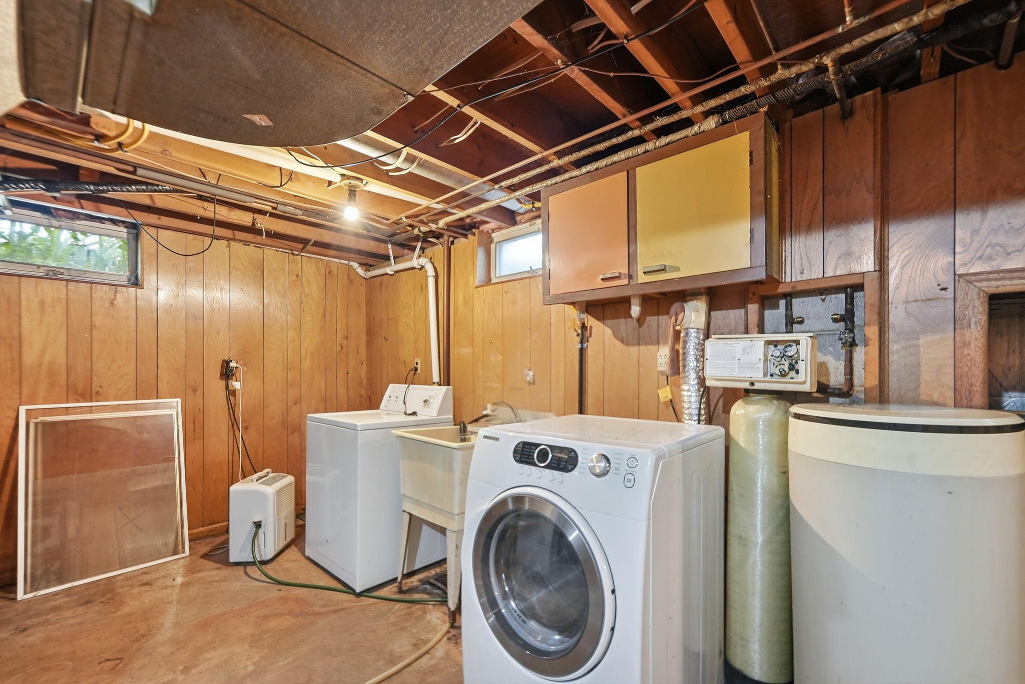 Laundry room doubles as a the mechanical room. Laundry features a utility sink.