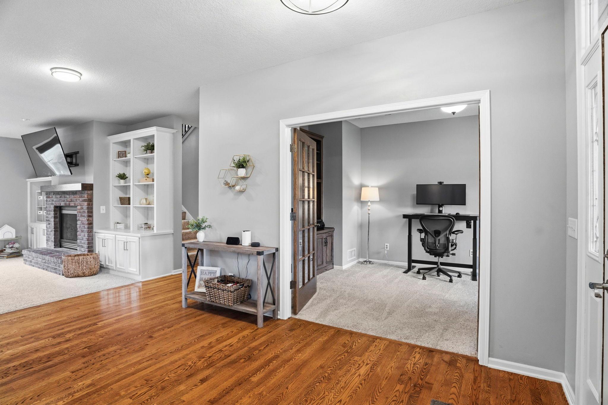 The 13x11 office has glass panel doors and built in cabinetry.