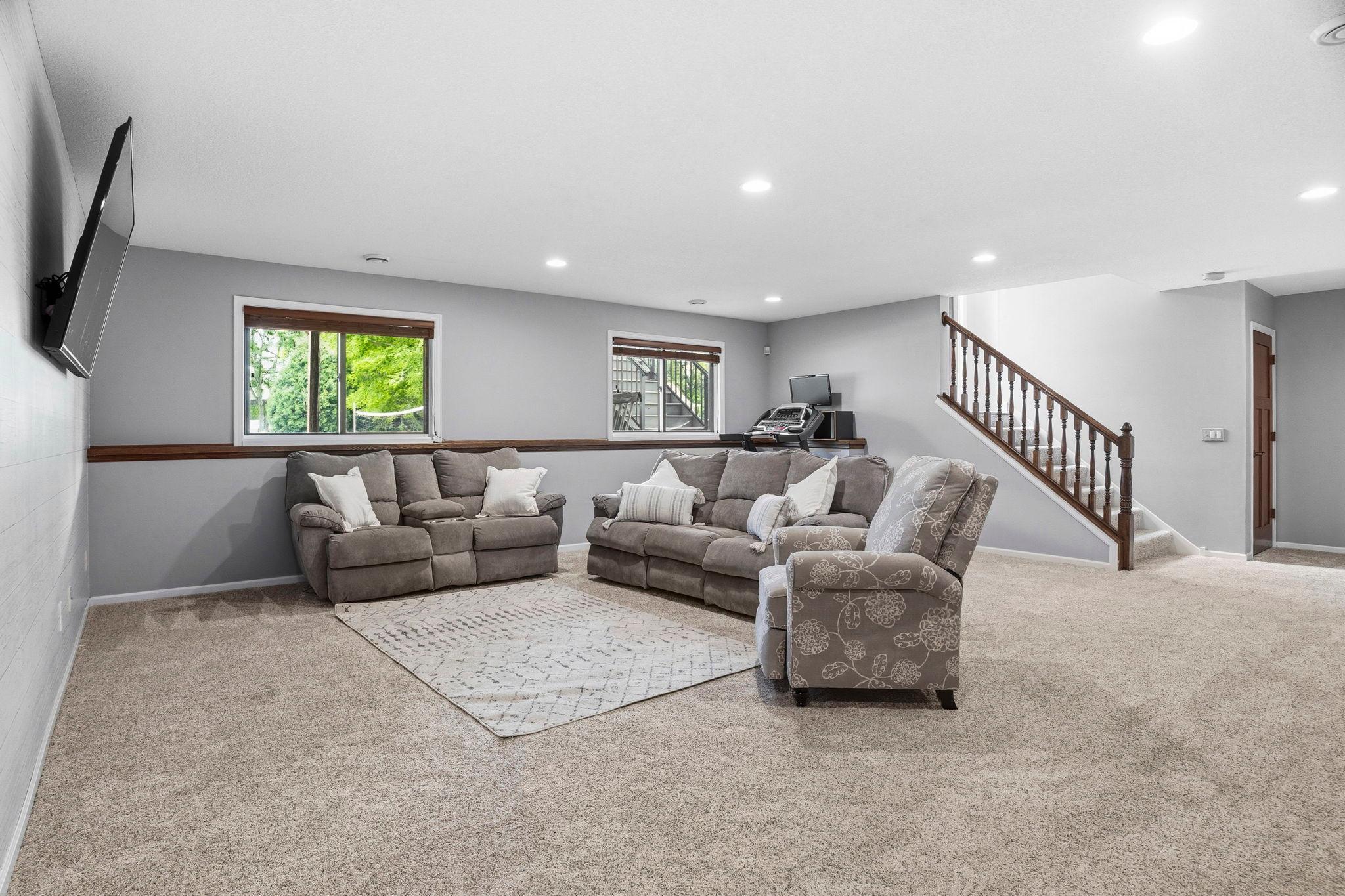 The gigantic 22x20 lower level family room for movie nights, entertaining, or working out. Enjoy the warmth of infloor heat.