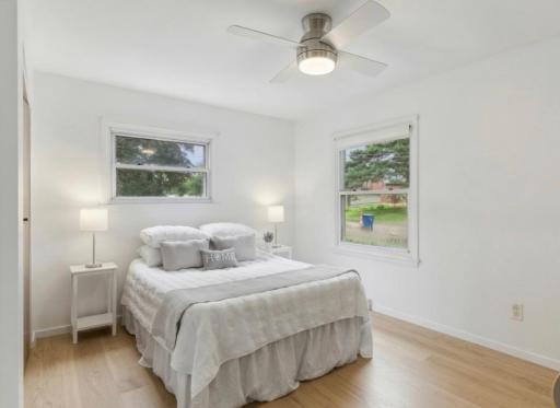 AI generated Bedroom update with hardwood floors exposed and refinished.