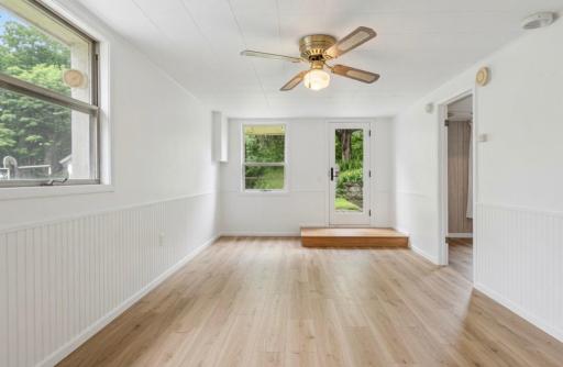 AI generated update with LVT flooring and new paint
