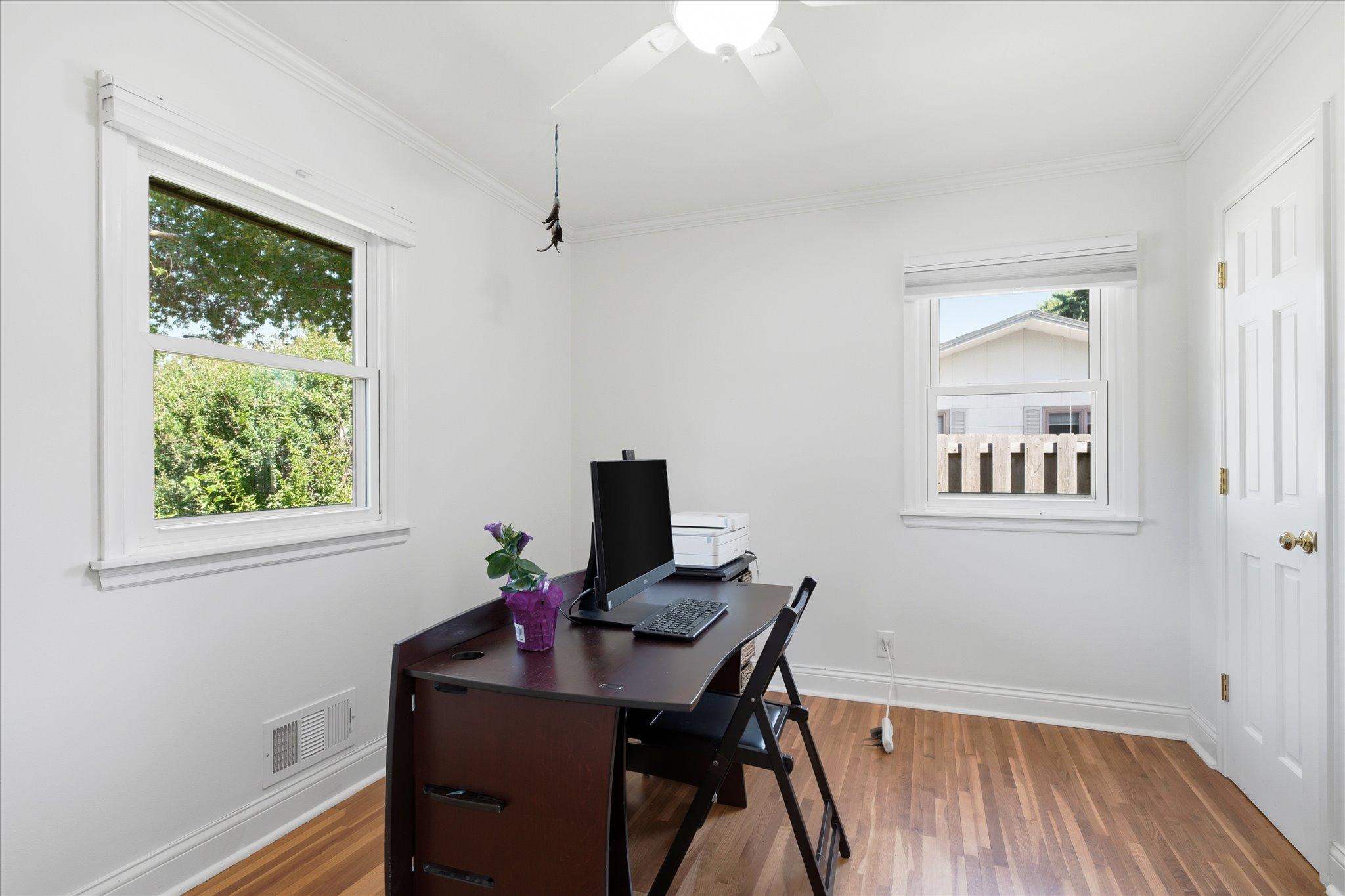 Second bedroom on the main level offering flexibility for guests, or a home office!