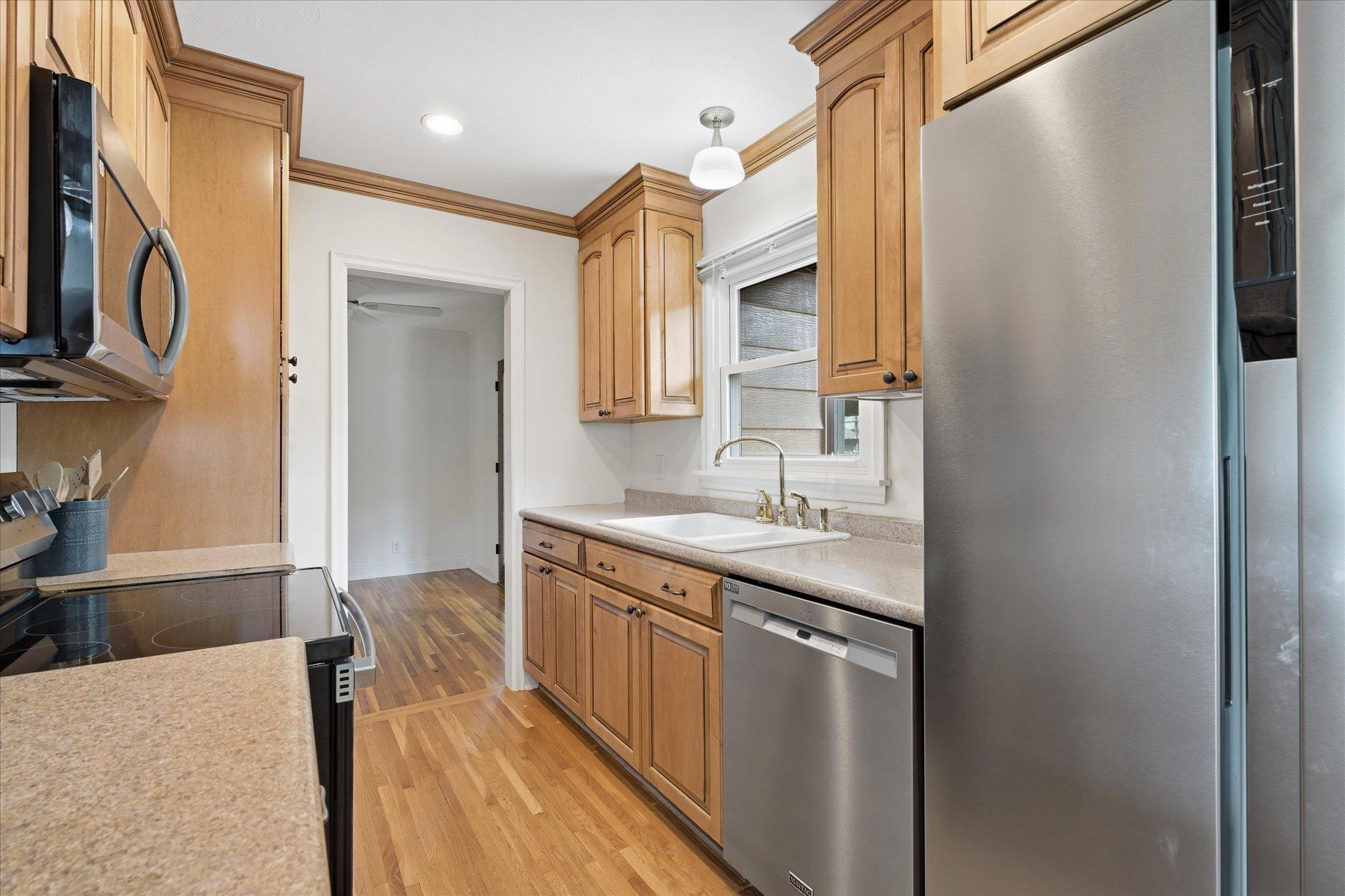 Prepare your favorite recipes in this updated kitchen featuring newer cabinetry, and stainless steel appliances!