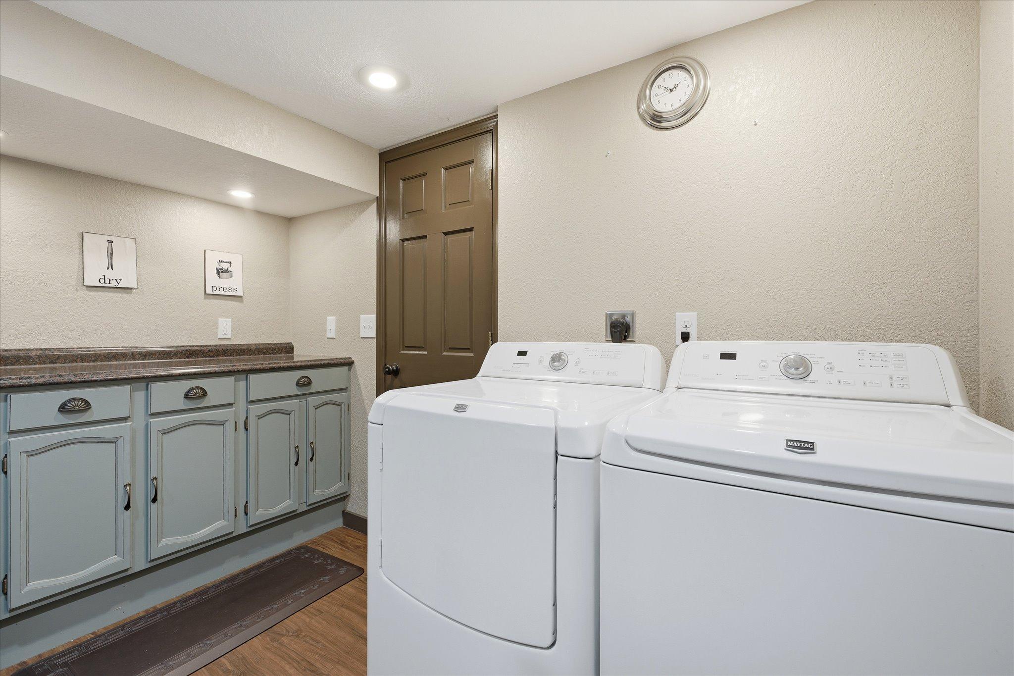 A thoughtfully designed laundry room with abundant storage and countertop space to simplify daily routines!