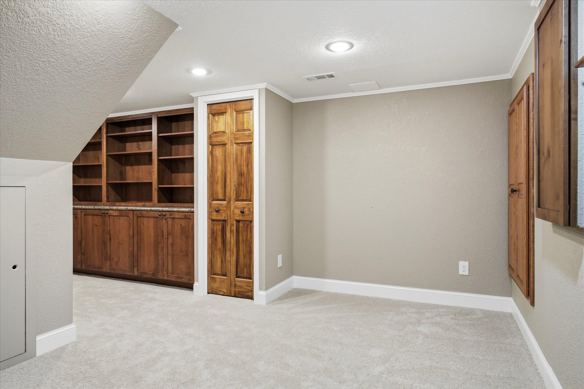 Abundant built-ins and flexible living space make the lower level ideal for entertaining!