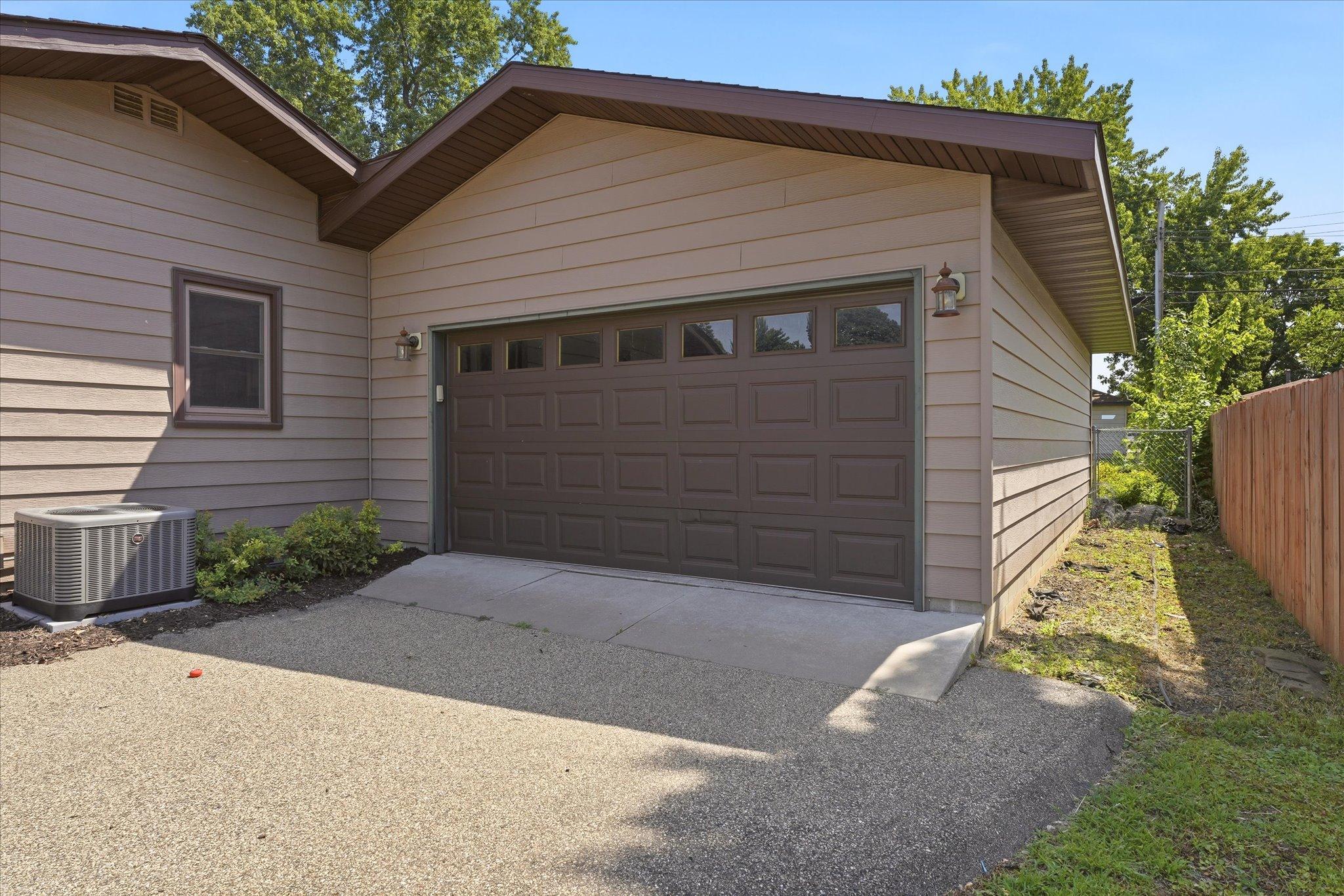 The oversized attached garage features extra-deep stalls, abundant storage, and space for hobbies or projects!