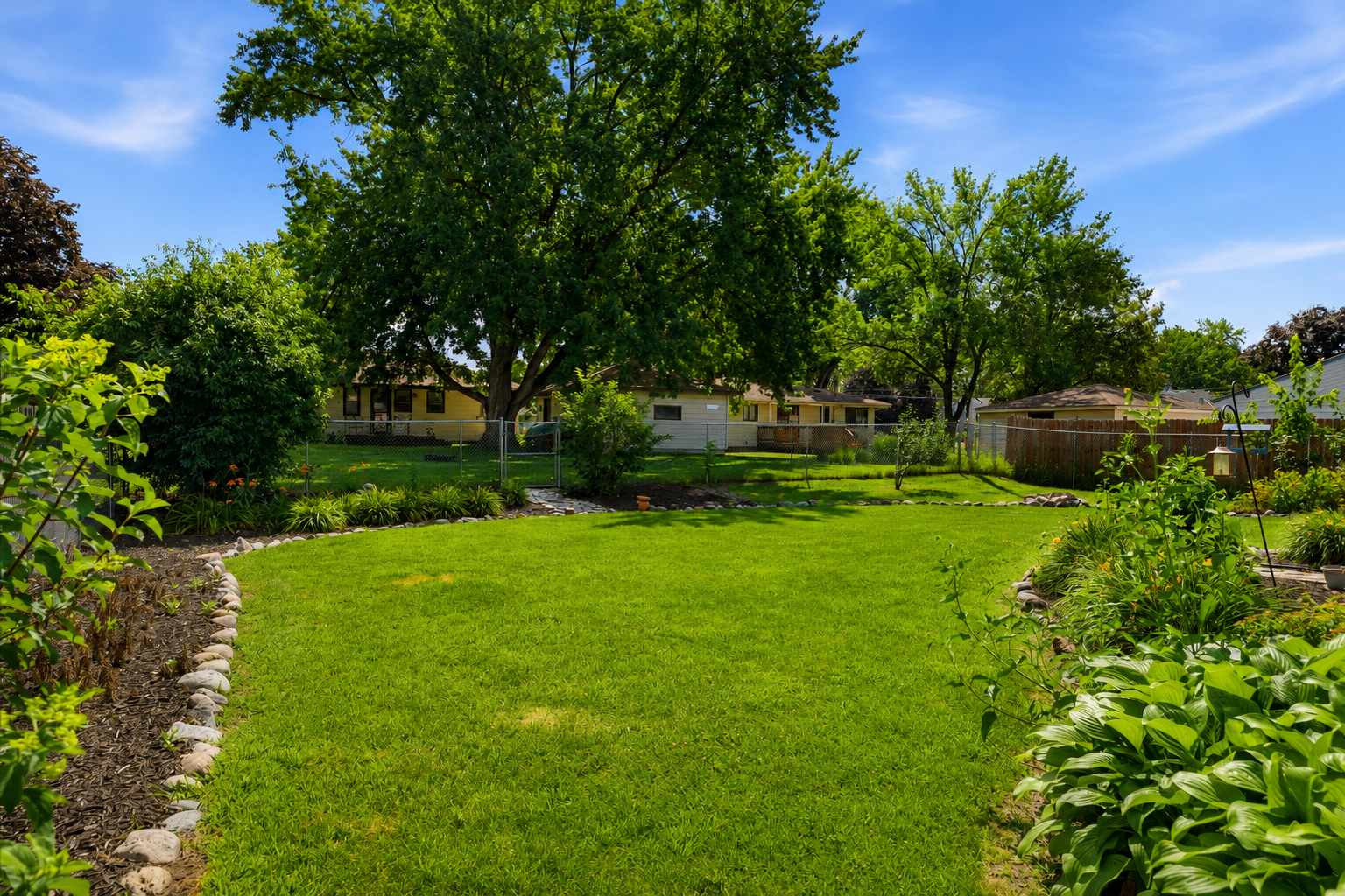 The spacious, fully fenced backyard offers endless opportunities for outdoor fun