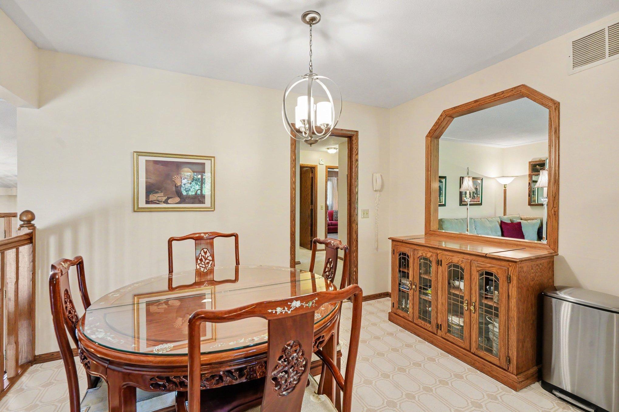 Dining table can be expanded to accommodate guests for a sit-down dinner. Opening to living room expands conversation to next room.