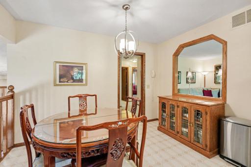 Dining table can be expanded to accommodate guests for a sit-down dinner. Opening to living room expands conversation to next room.
