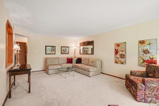 Sectional, a couple of chairs fit easily.