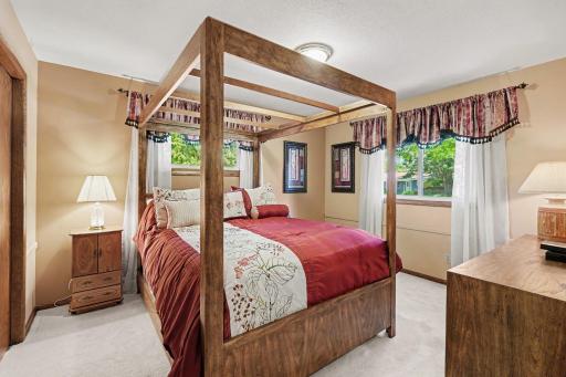 Primary bedroom easily fits a queen or king size bed hardwood floors under carpet.