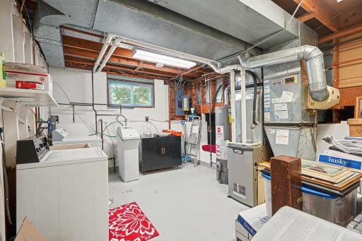 A well-lit laundry painted brightly for nice work space.
