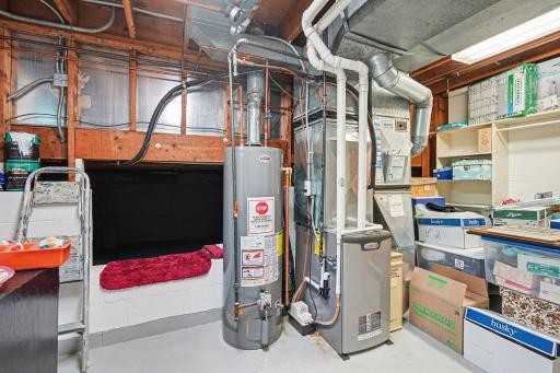 Crawl space is accessed from laundry/utility room. Furnace is 13 years old and water heater replaced 2019. 200 AMP electrical upgrade 2012.