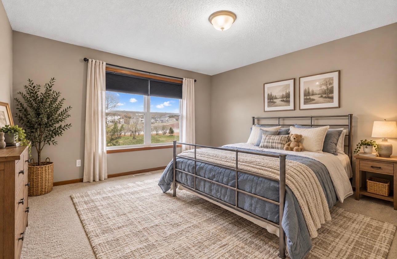Guest bedroom (1) over looking pond- AI
