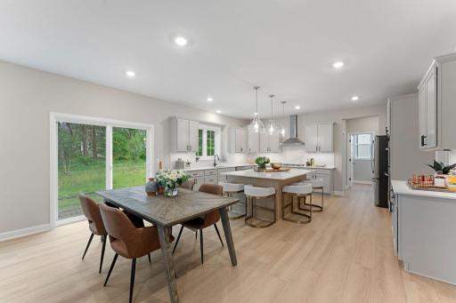 (Photo of a similar home, actual finishes may vary) Residents can easily serve piping-hot meals straight off the stove and onto the dining table