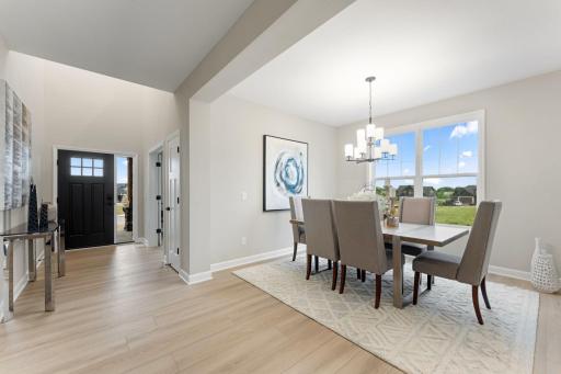 (Photo of a similar home, actual finishes may vary) Tucked conveniently between the Great Room and the office is a formal dining room, ideal for cozy meals with family and important occasions with friends.