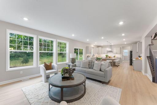 (Photo of a similar home, actual finishes may vary) Direct access to the dining room makes the Great Room a central meeting place for family members