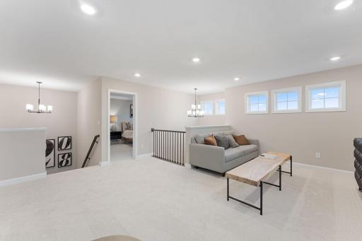 (Photo of a similar home, actual finishes may vary) Centrally located on the second floor, the loft adds shared living space that could be a space for movies and games, as itâs configured here.