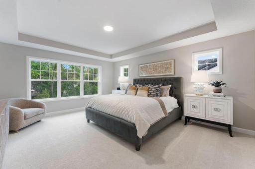 (Photo of a similar home, actual finishes may vary) Offering a private retreat made for rest and relaxation, the second-floor ownerâs suite provides space for a seating area, a walk-in closet and a spa-inspired bathroom.